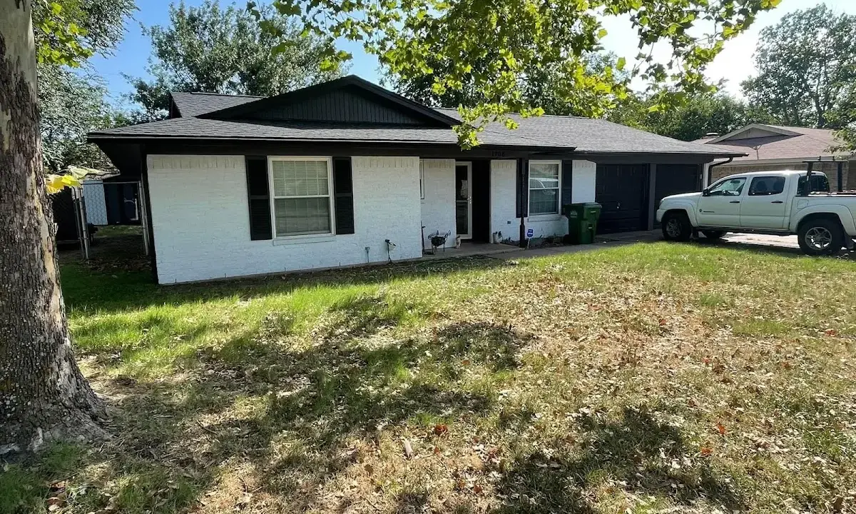 Professional roofing crew working on a residential roof in Buenaventura Lakes